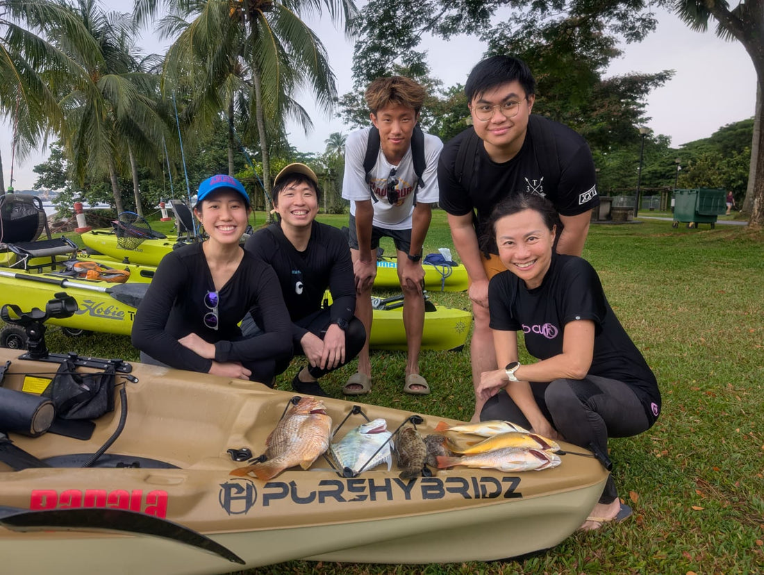 Family hauls in a feast on purehybridz kayak fishing tours in Pulau Ubin