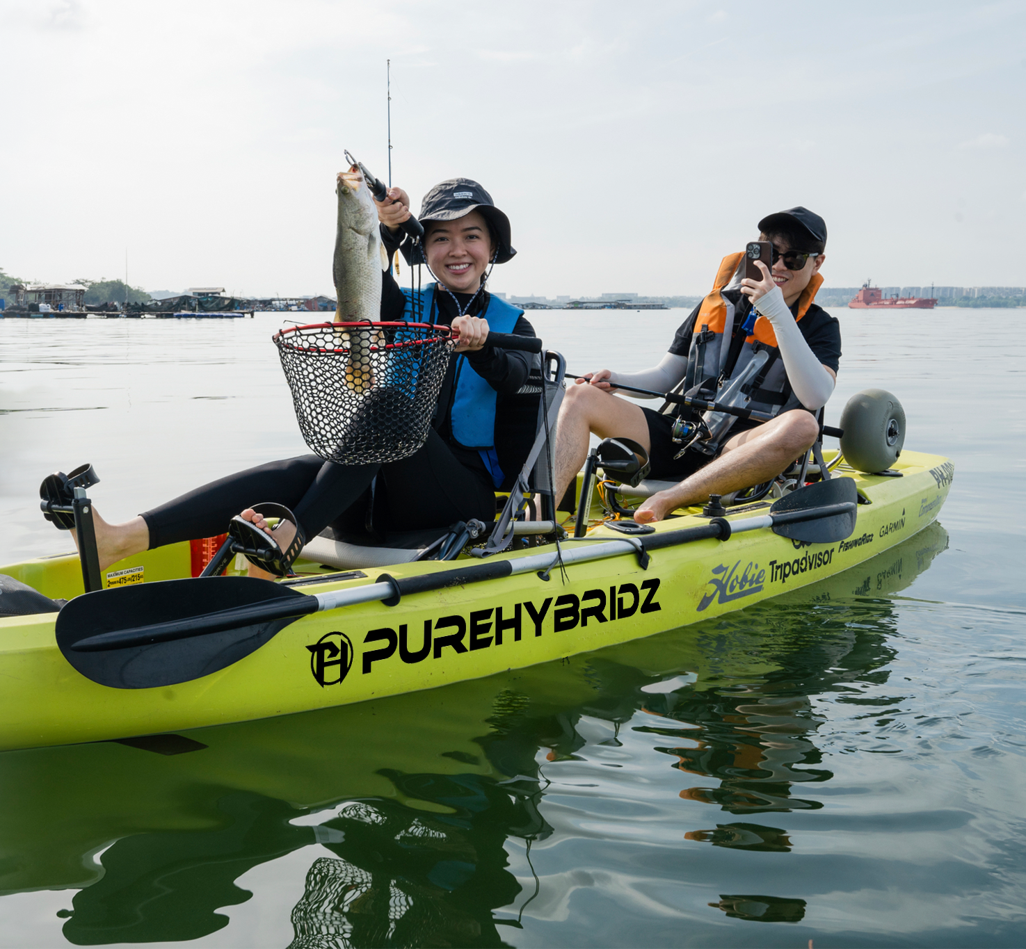 Purehybridz Kayak Fishing customers catches big barramundi on kayak Singapore