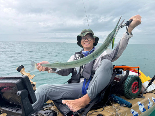 Kayak fishing guide Marcus lands huge needlefish on brown Hobie Passport kayak - VIP kayak fishing pass