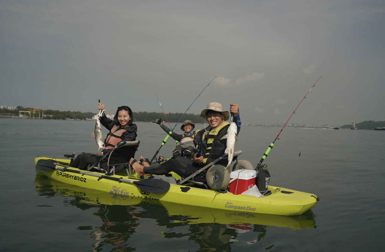 Guests catch 2 catfish at one time (double hook up) on Purehybridz Kayak fishing tours