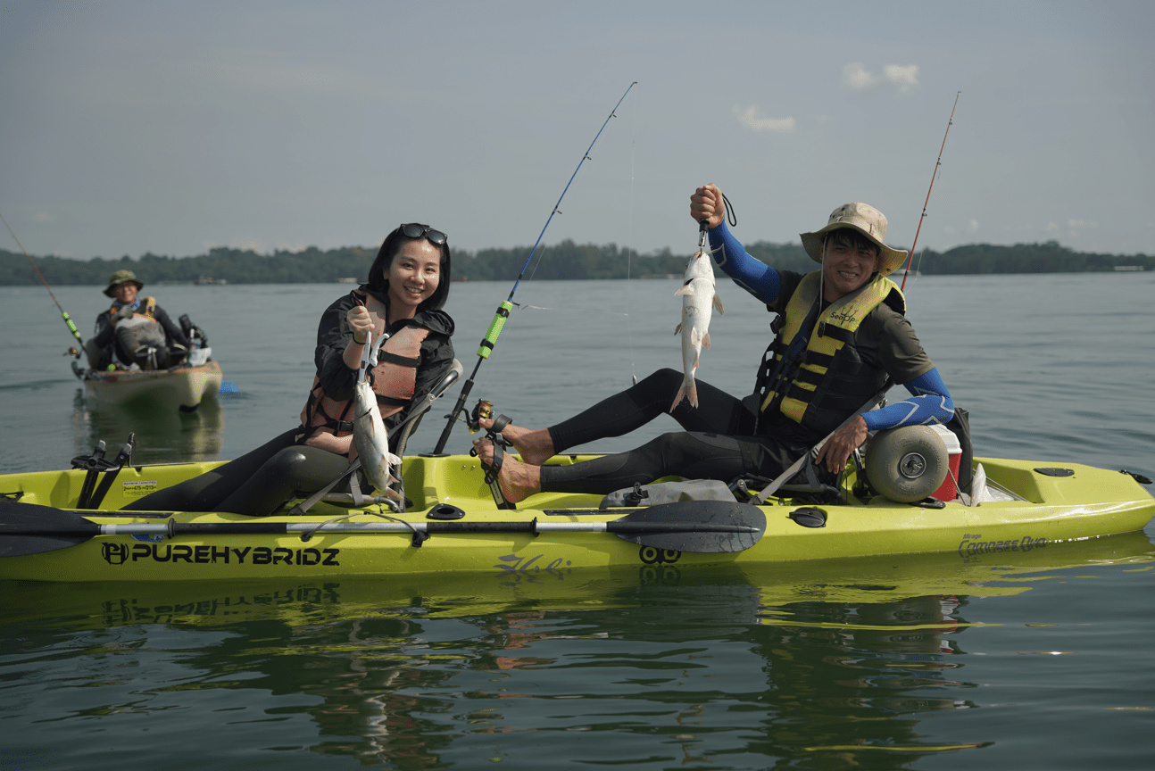 Couple catches a huge catfish on Purehybridz Kayak Fishing Tour in Pulau Ubin 