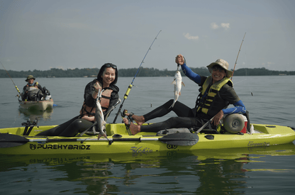 Guests catch 2 catfish at one time (double hook up) on Purehybridz Kayak fishing tours