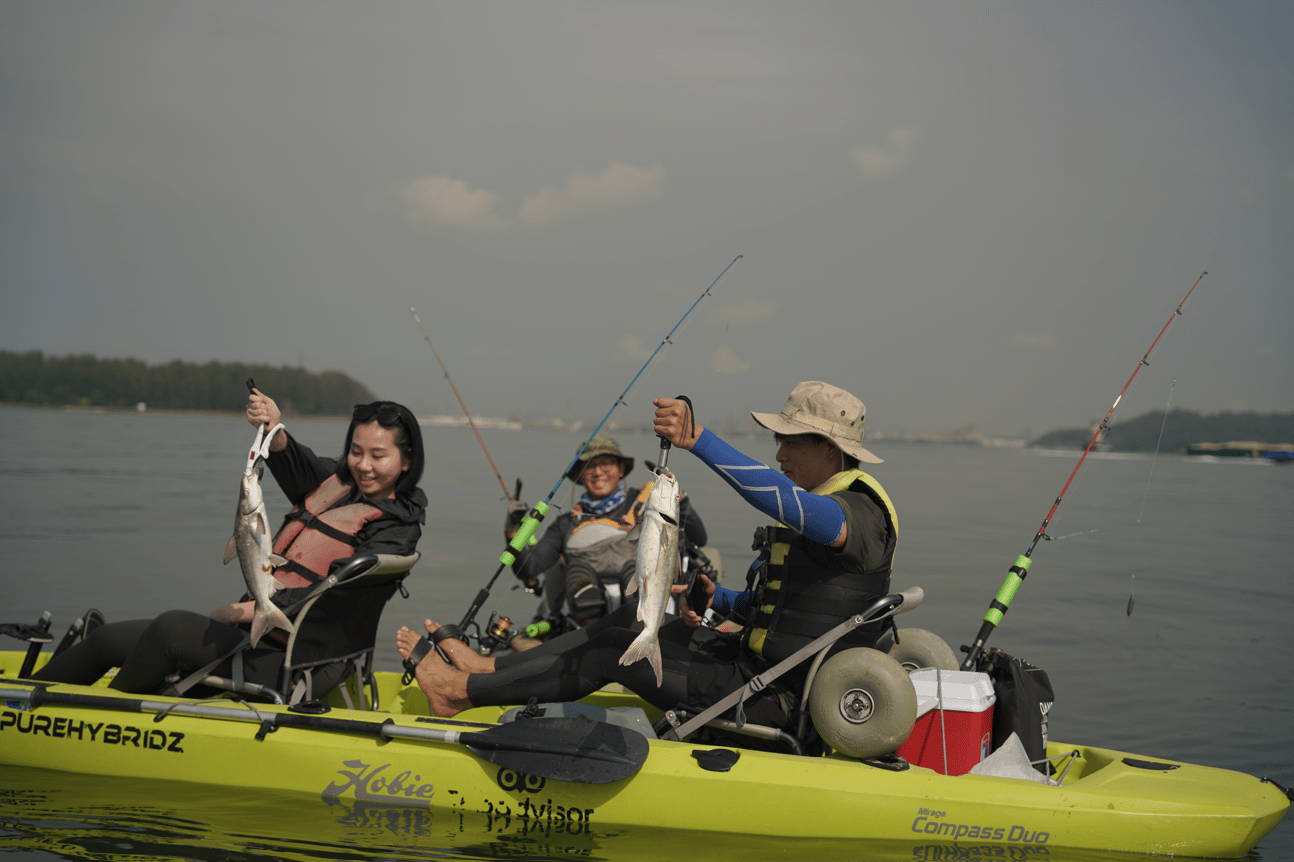 Kayak fishing guide Dom with his brown Hobie Passport Kayak and Garmin Striker Fishfinder