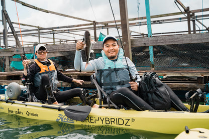 Male angler catches a marine catfish on Purehybridz Kayak Fishing Tours in Pulau Ubin